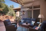 A covered outdoor seating area links the Casita with the main home